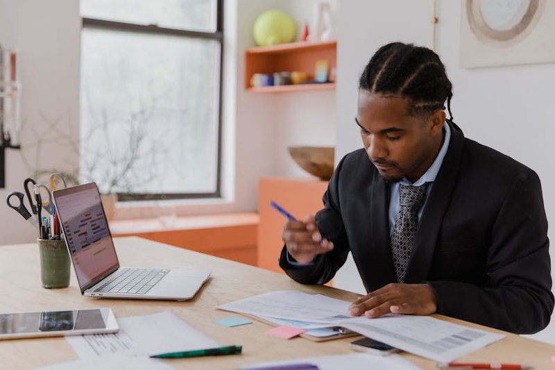 Singapore business owner reviewing an SEO proposal with clear pricing tiers and service breakdowns on a tablet